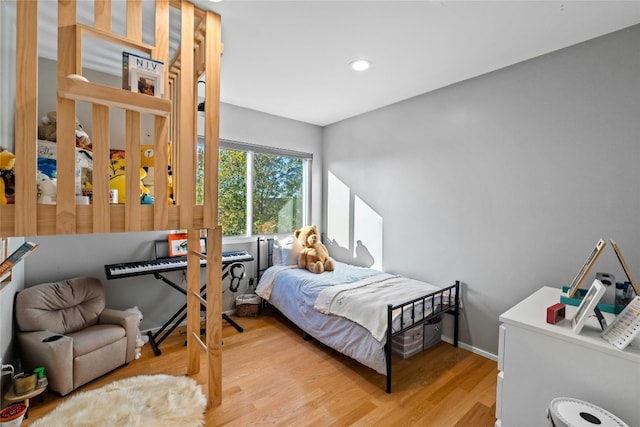 bedroom with light hardwood / wood-style flooring