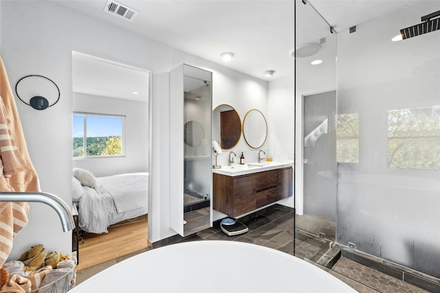 bathroom with vanity and a tub to relax in