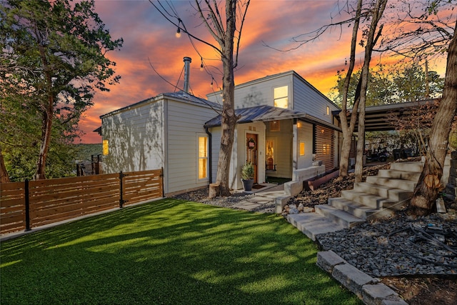 view of front of home featuring a yard