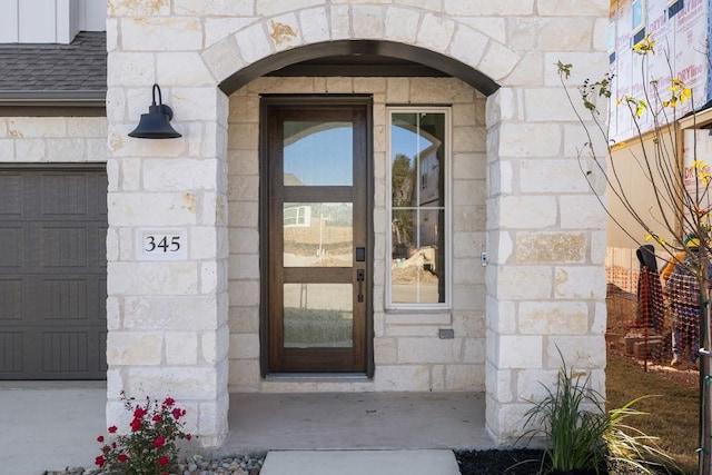 entrance to property featuring a garage