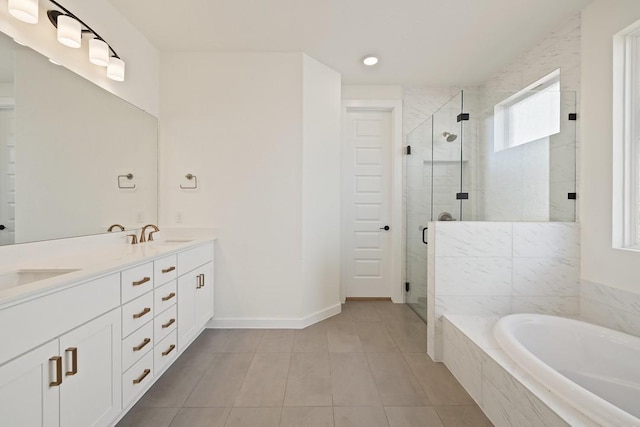 bathroom with tile patterned flooring, vanity, and separate shower and tub