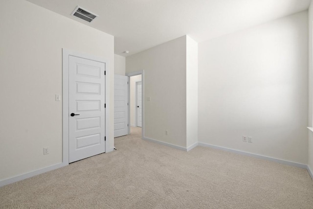 empty room with light colored carpet