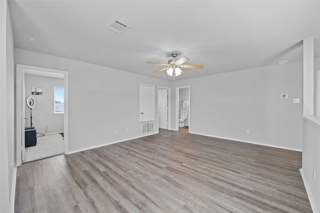 empty room with light hardwood / wood-style floors and ceiling fan