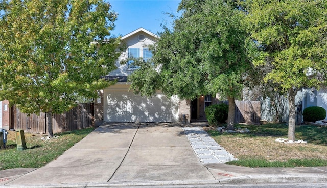 obstructed view of property featuring a garage