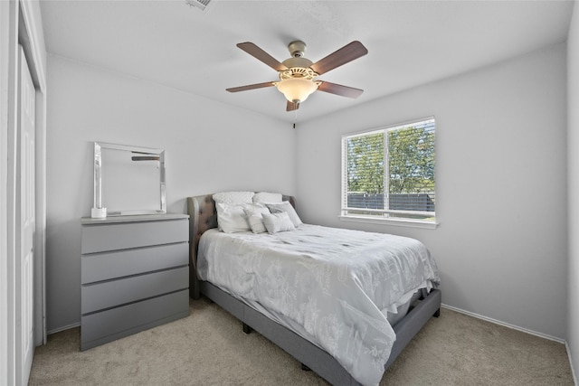 carpeted bedroom with ceiling fan