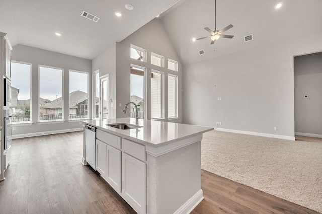 325 Crescent Heights Dr, Georgetown, TX 78628 - kitchen featuring a sink, visible vents, vaulted ceiling, and open floor plan