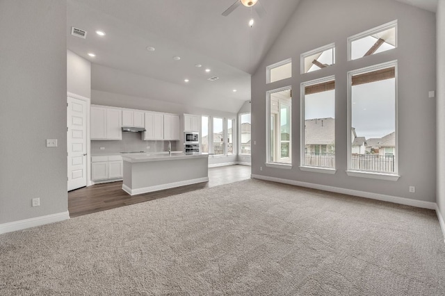 325 Crescent Heights Dr, Georgetown, TX 78628 - living area with visible vents, dark carpet, baseboards, ceiling fan, and recessed lighting