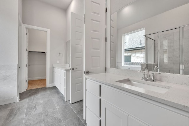 325 Crescent Heights Dr, Georgetown, TX 78628 - full bath featuring vanity, a stall shower, and a spacious closet