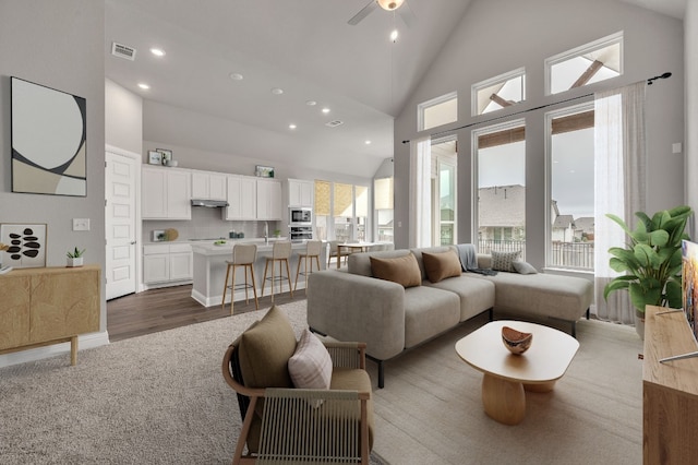 325 Crescent Heights Dr, Georgetown, TX 78628 - living room featuring recessed lighting, high vaulted ceiling, visible vents, and a ceiling fan