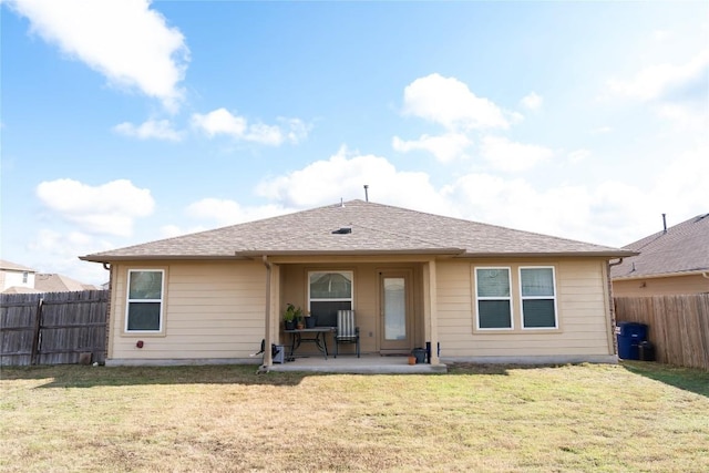 100 Wilson Ct, Hutto, TX 78634 - rear view of house with a fenced backyard and a patio