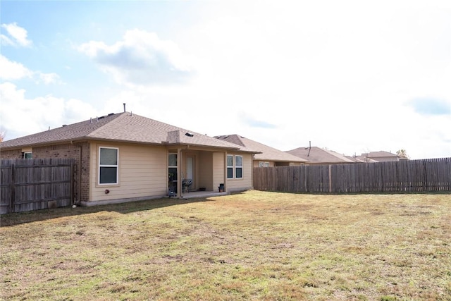 100 Wilson Ct, Hutto, TX 78634 - rear view of property featuring a fenced backyard