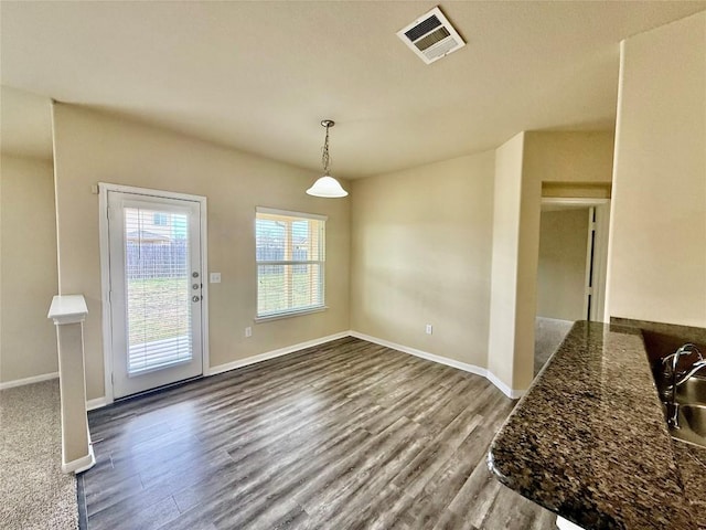 100 Wilson Ct, Hutto, TX 78634 - unfurnished dining area with dark wood finished floors