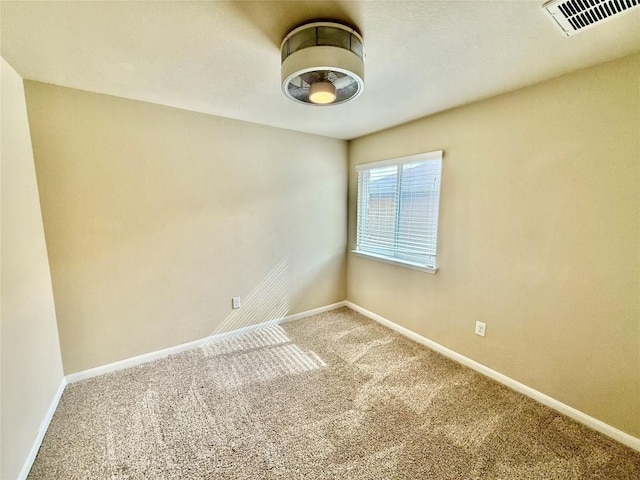 unfurnished room featuring carpet floors