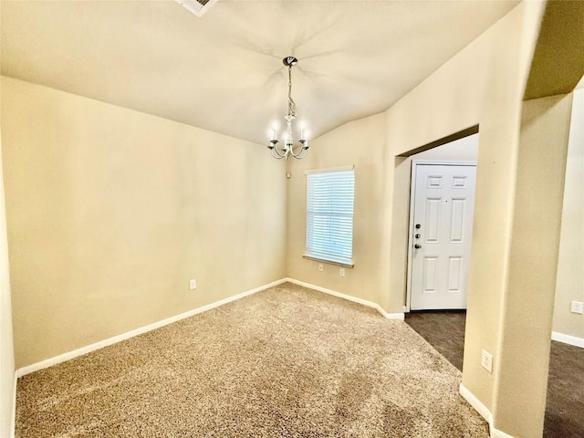 spare room featuring vaulted ceiling, a notable chandelier, and dark carpet