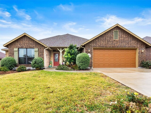 single story home featuring a front yard and a garage