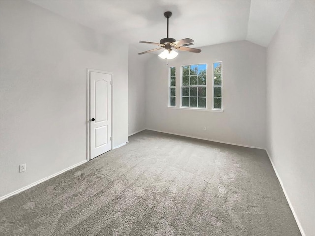 unfurnished room featuring ceiling fan, carpet floors, and lofted ceiling