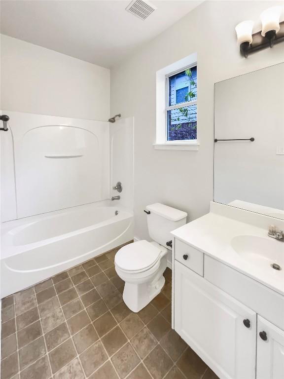 full bathroom featuring tile patterned floors, vanity, toilet, and tub / shower combination