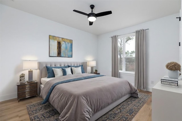 bedroom featuring light hardwood / wood-style flooring and ceiling fan