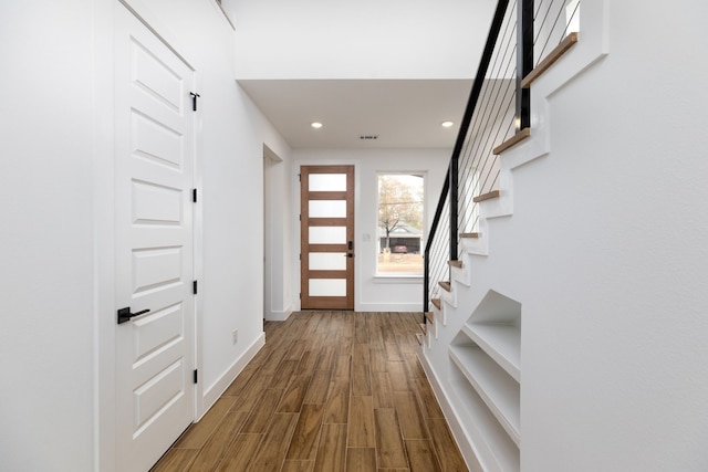 entryway with hardwood / wood-style floors