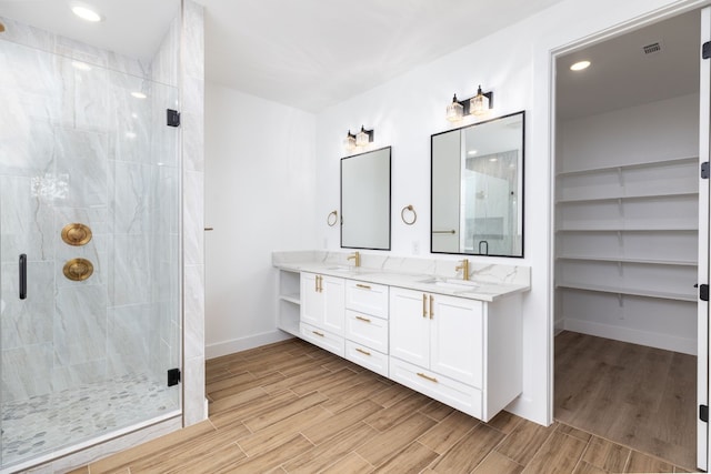 bathroom featuring vanity and walk in shower