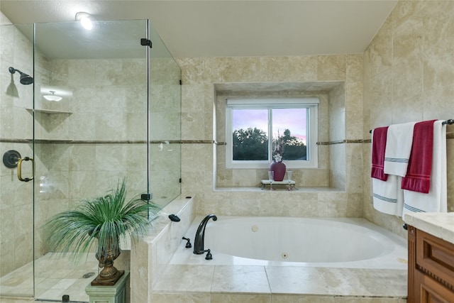 bathroom featuring vanity and separate shower and tub