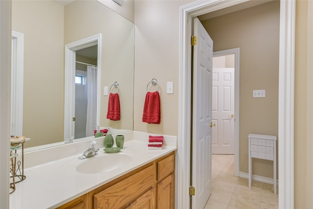 bathroom with vanity and tile patterned floors