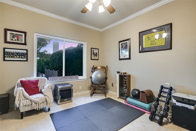 exercise room with ceiling fan, light tile patterned flooring, and ornamental molding