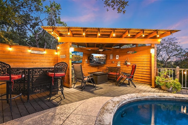 wooden deck with a pergola and ceiling fan