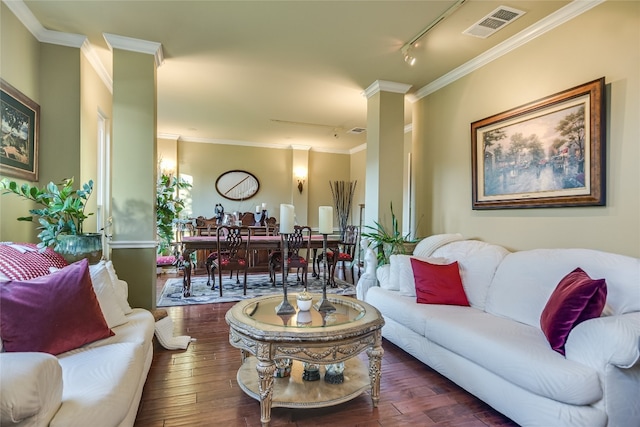 living room with dark hardwood / wood-style flooring, rail lighting, and ornamental molding