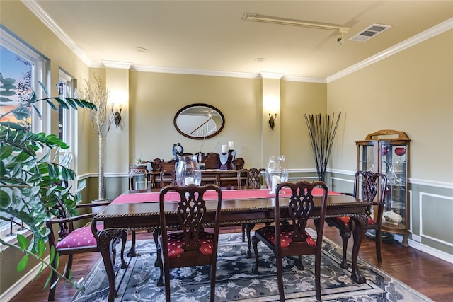 dining room featuring hardwood / wood-style floors and ornamental molding