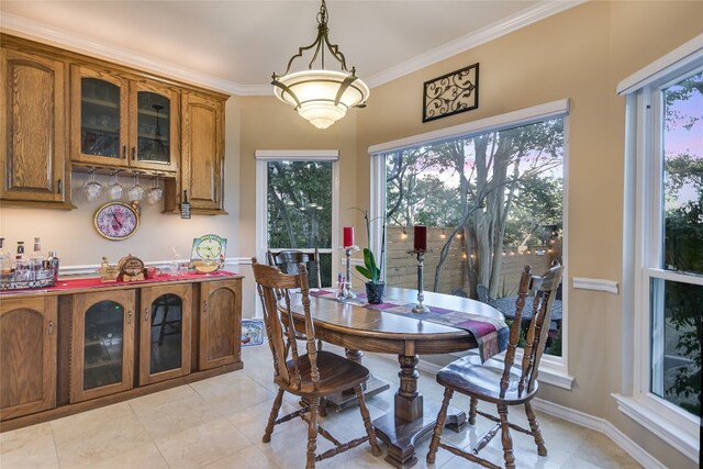 tiled dining room with ornamental molding