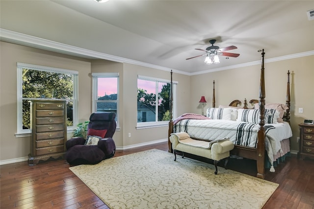 bedroom with ornamental molding, ceiling fan, and dark wood-type flooring