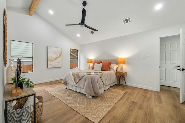 bedroom with ceiling fan, high vaulted ceiling, beam ceiling, and light hardwood / wood-style flooring