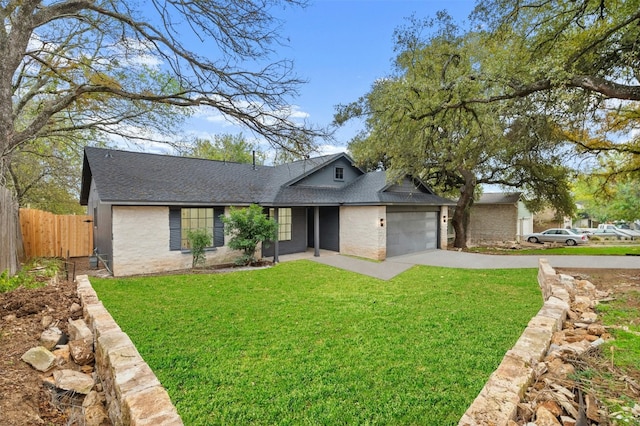 view of front facade with a garage and a front yard