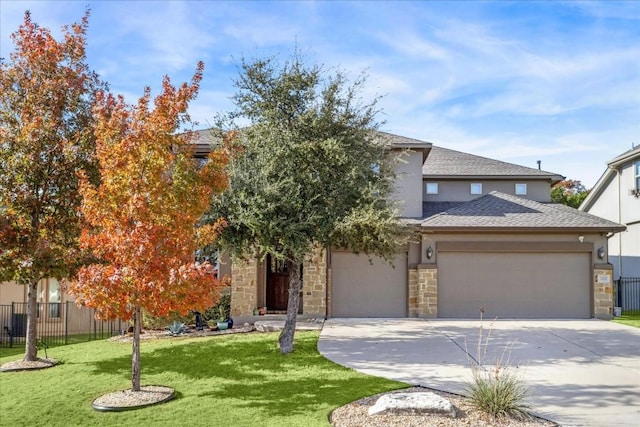 obstructed view of property featuring a front yard and a garage