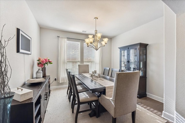 dining space with a chandelier