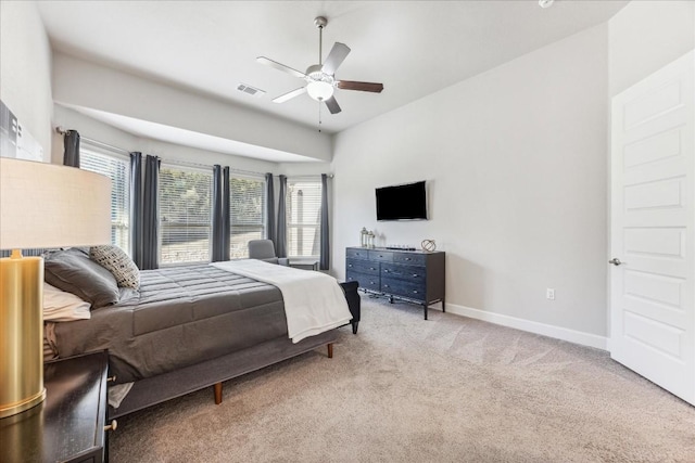 bedroom with ceiling fan and light colored carpet