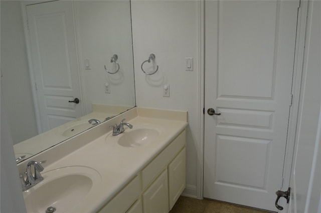 bathroom featuring tile patterned flooring and vanity