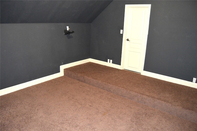 additional living space with carpet and lofted ceiling