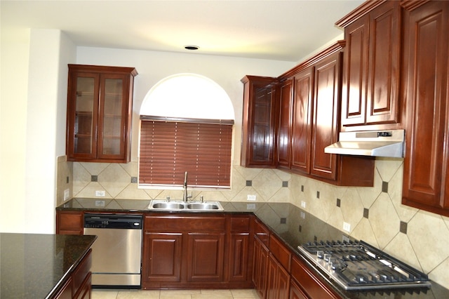 kitchen with decorative backsplash, sink, light tile patterned flooring, and appliances with stainless steel finishes