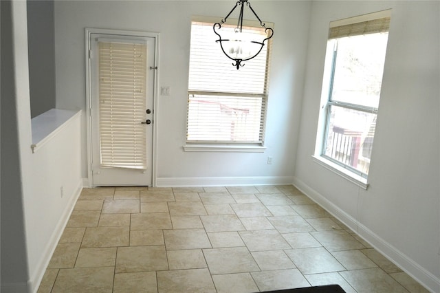 entryway featuring light tile patterned floors and a wealth of natural light