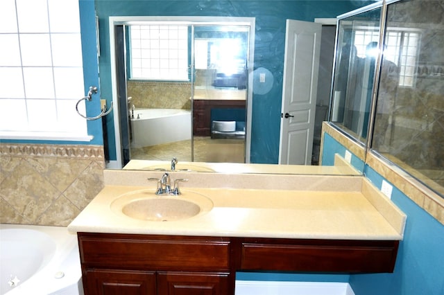 bathroom with plus walk in shower and vanity