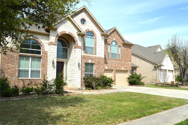 view of front of property with a garage and a front yard