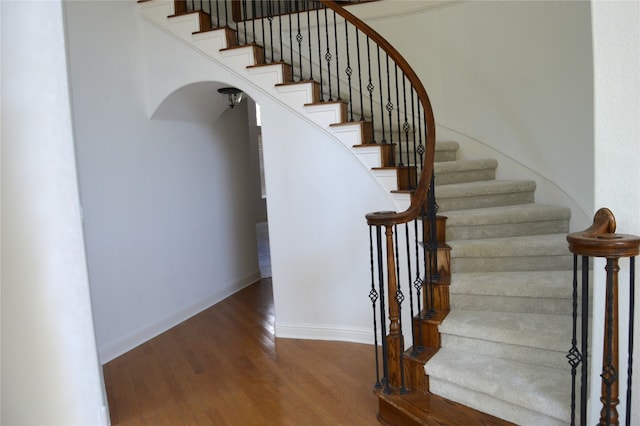 stairway featuring hardwood / wood-style flooring