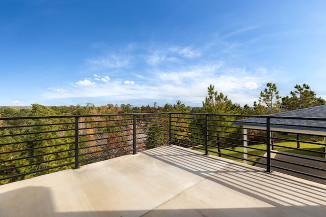 view of patio featuring a balcony