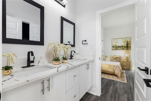 bathroom with vanity and wood-type flooring