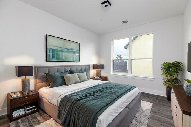 bedroom featuring dark wood-type flooring