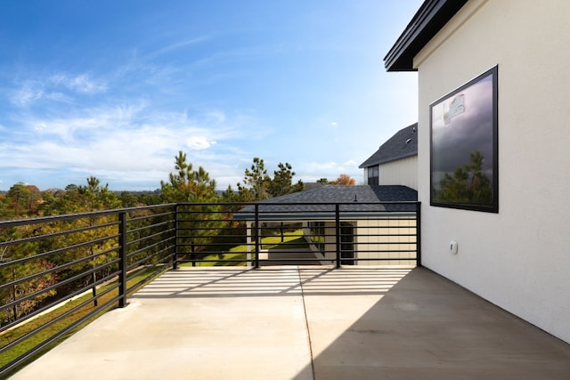 view of patio with a balcony