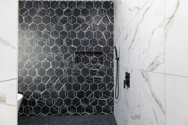 103 Onini Ct, Bastrop, TX 78602 - bathroom featuring a marble finish shower and toilet