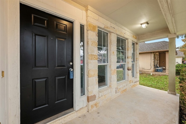 property entrance with a porch